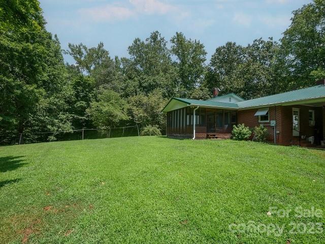 709 Green Road Rutherfordton, NC 28139 - Photo 2 of 46 a front view of house with a garden and trees