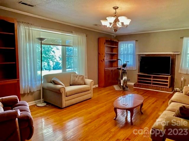 709 Green Road Rutherfordton, NC 28139 - Photo 21 of 46 a living room with furniture a flat screen tv and a large window