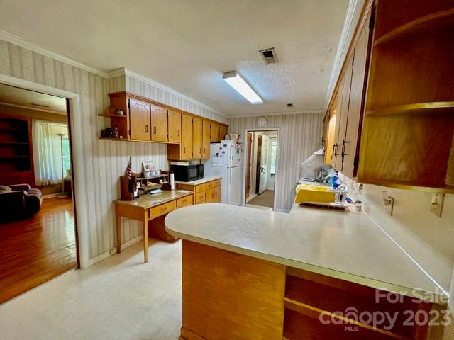 709 Green Road Rutherfordton, NC 28139 - Photo 24 of 46 a view of kitchen center island dining table and appliances