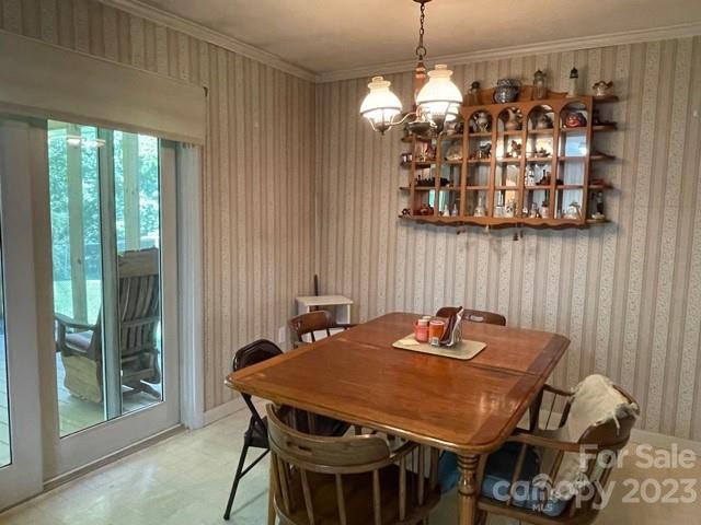 709 Green Road Rutherfordton, NC 28139 - Photo 25 of 46 a view of a dining room with furniture and chandelier