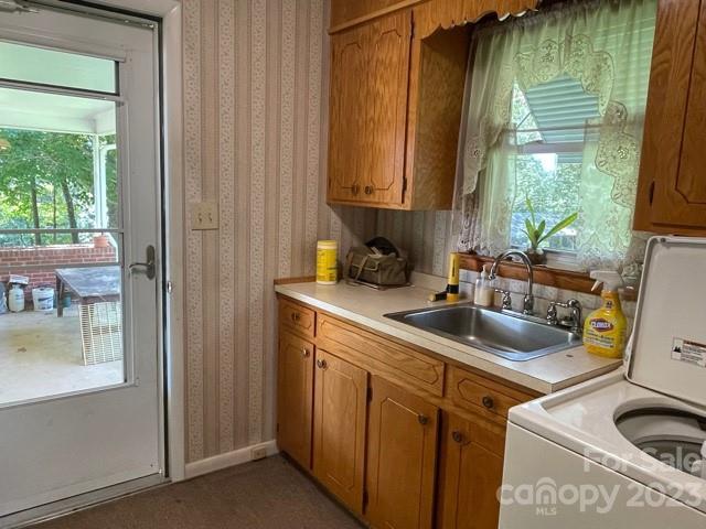 709 Green Road Rutherfordton, NC 28139 - Photo 26 of 46 a kitchen with sink a window and cabinets