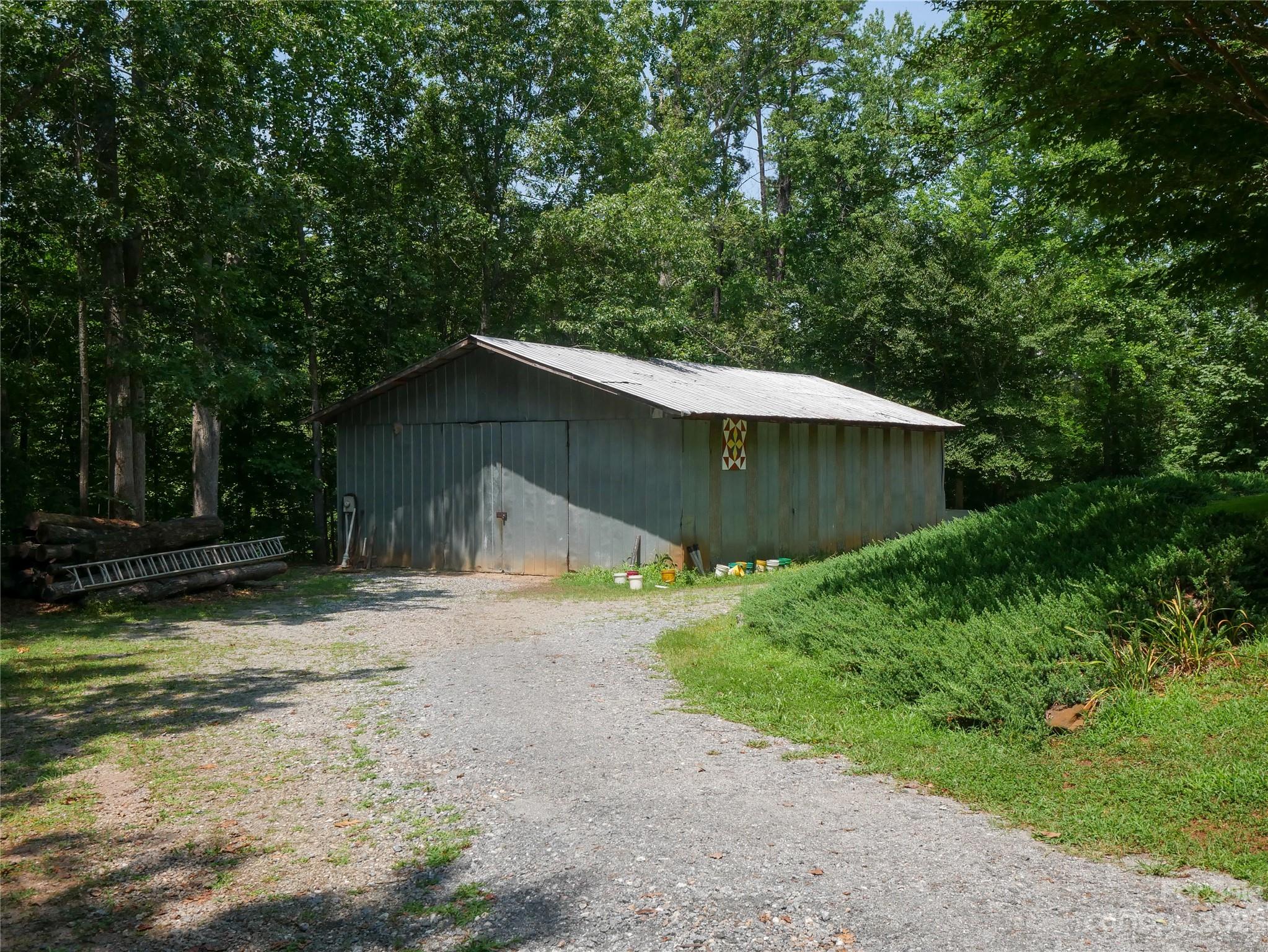 709 Green Road Rutherfordton, NC 28139 - Photo 4 of 46 a house with trees in the background