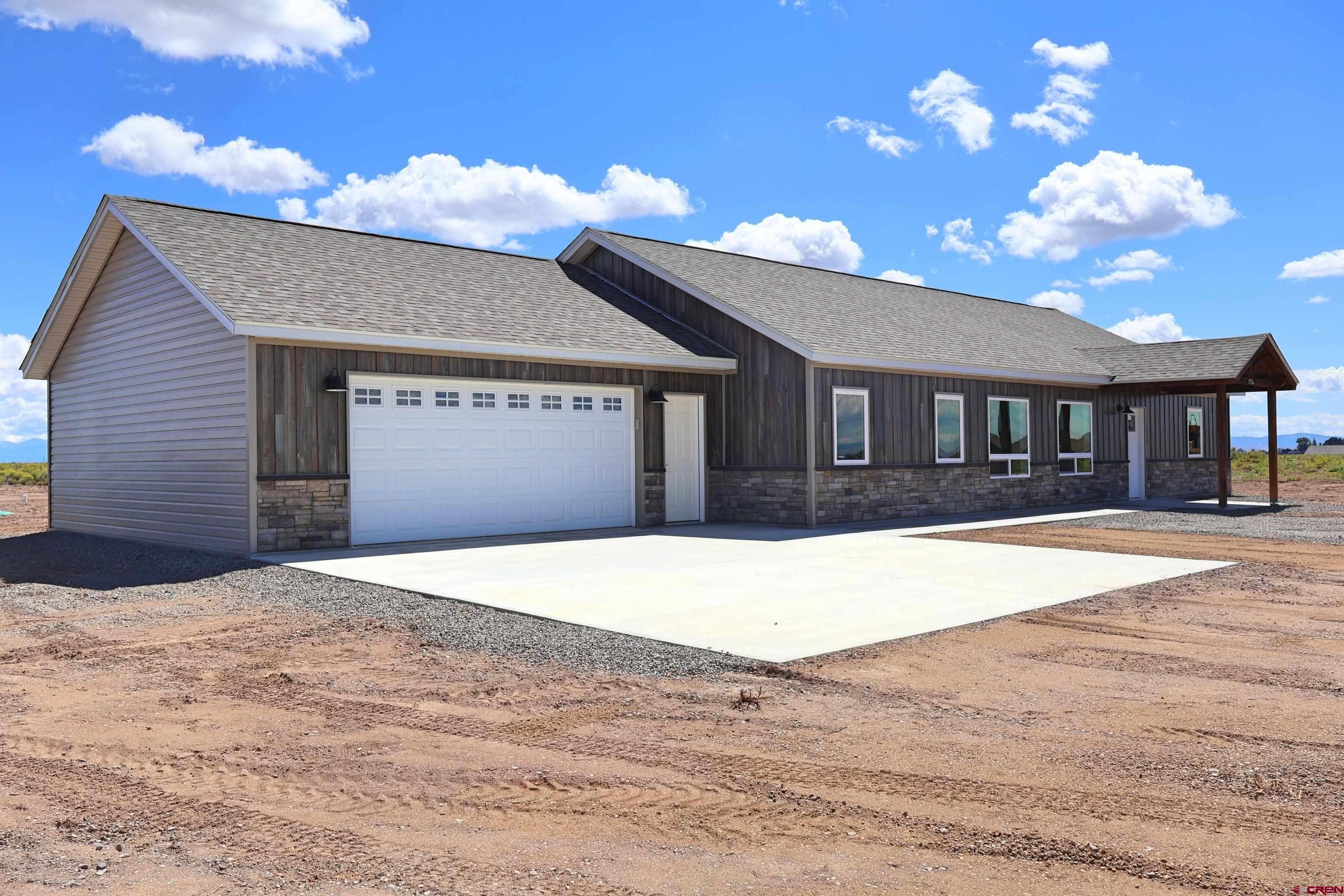 8714 Ridgetop Drive Alamosa, CO 81101 - Photo 4 of 18 a house view with a swimming pool