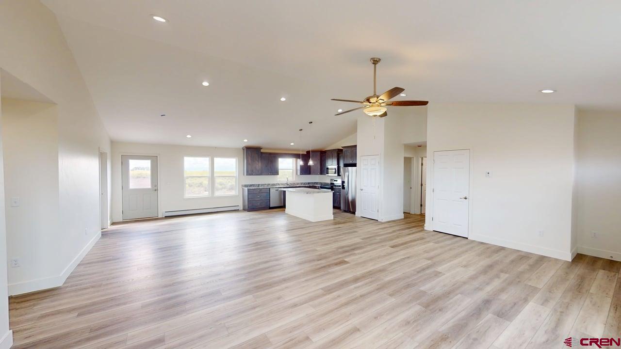 8714 Ridgetop Drive Alamosa, CO 81101 - Photo 6 of 18 a view of a kitchen with a sink and a window