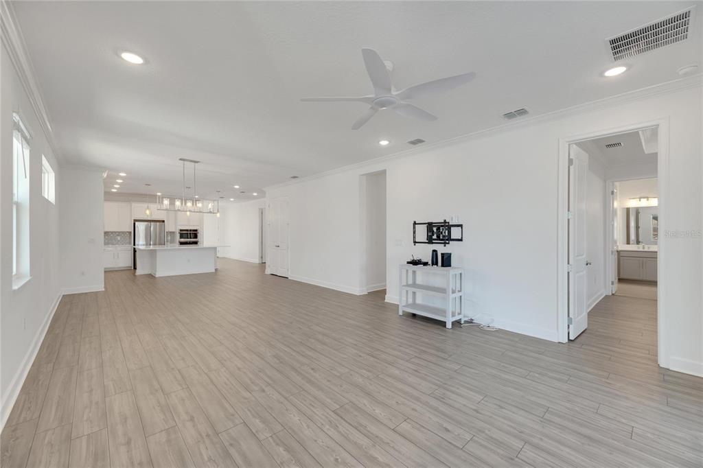 923 Signet Drive Apollo Beach, FL 33572 - Photo 16 of 84 a view of a kitchen with a sink and a refrigerator