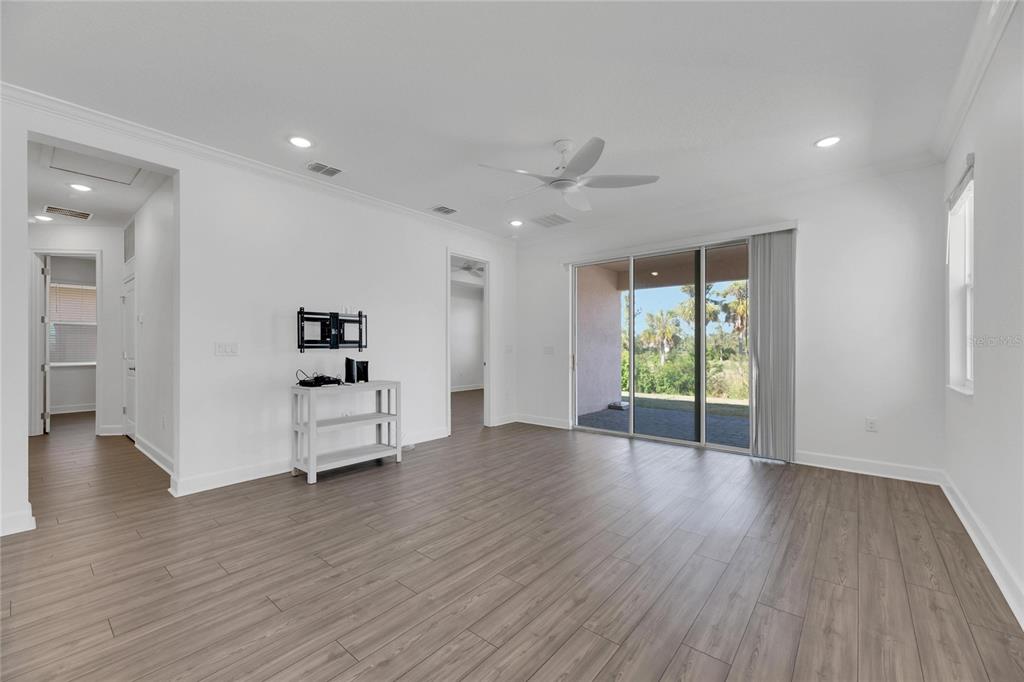 923 Signet Drive Apollo Beach, FL 33572 - Photo 29 of 84 a view of an empty room with wooden floor and a window