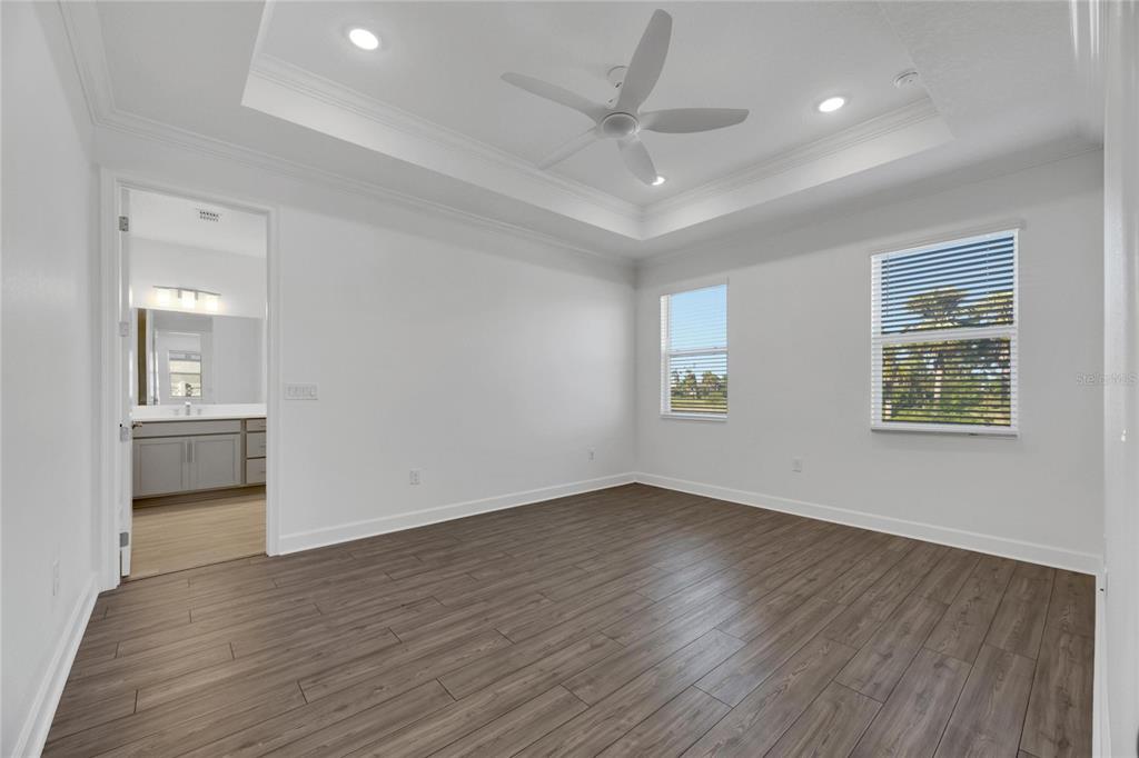 923 Signet Drive Apollo Beach, FL 33572 - Photo 32 of 84 a view of an empty room with a window and wooden floor