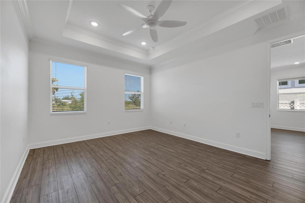 923 Signet Drive Apollo Beach, FL 33572 - Photo 34 of 84 wooden floor in an empty room with a window