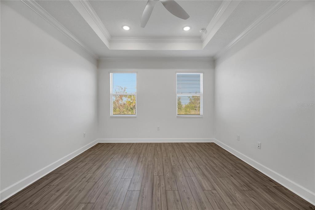 923 Signet Drive Apollo Beach, FL 33572 - Photo 36 of 84 an empty room with wooden floor and windows
