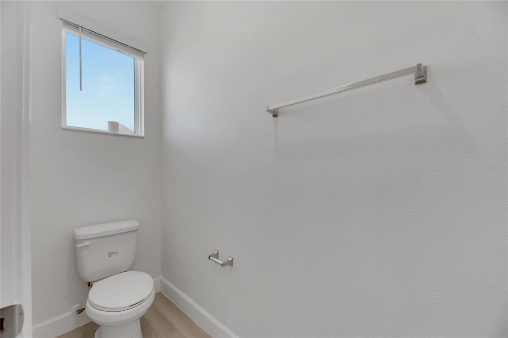 923 Signet Drive Apollo Beach, FL 33572 - Photo 38 of 84 a white toilet sitting next to a shower