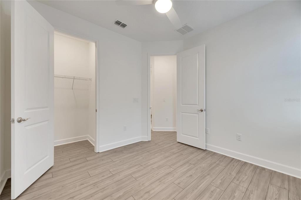 923 Signet Drive Apollo Beach, FL 33572 - Photo 45 of 84 a view of an empty room with wooden floor
