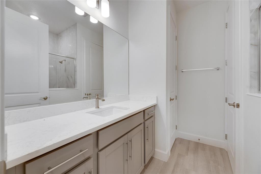 923 Signet Drive Apollo Beach, FL 33572 - Photo 51 of 84 a bathroom with a sink and a mirror