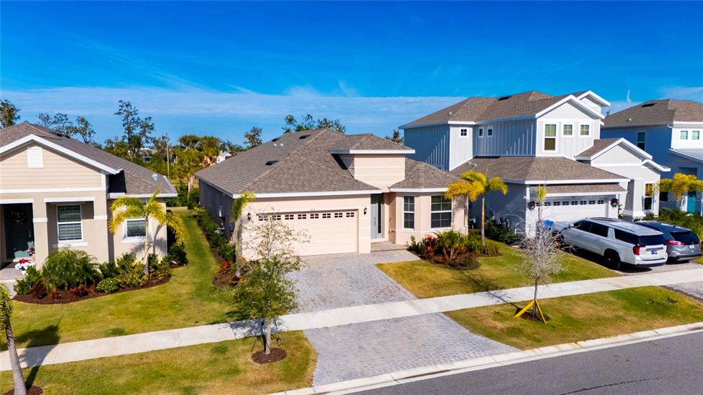 923 Signet Drive Apollo Beach, FL 33572 - Photo 68 of 84 a front view of a house with garden