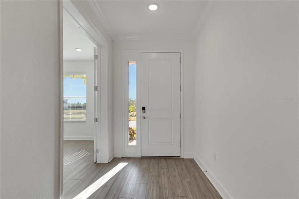 923 Signet Drive Apollo Beach, FL 33572 - Photo 8 of 84 a view of an empty room with closet and a window