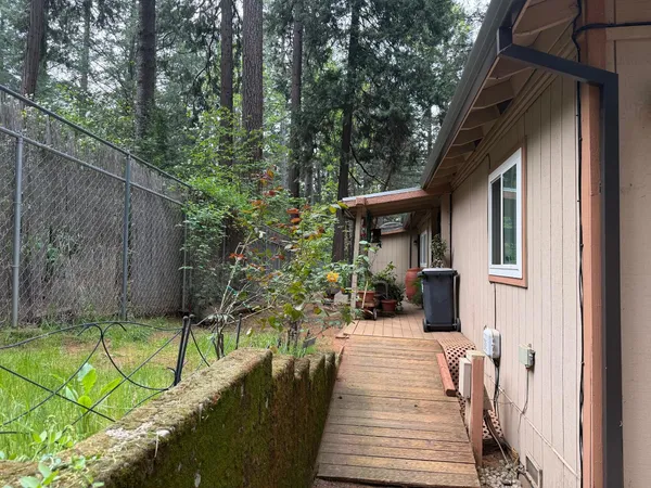 a view of a house with sitting area and potted plants