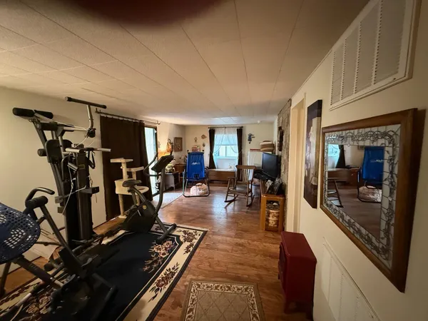 a bathroom with a sink a toilet a mirror and shower