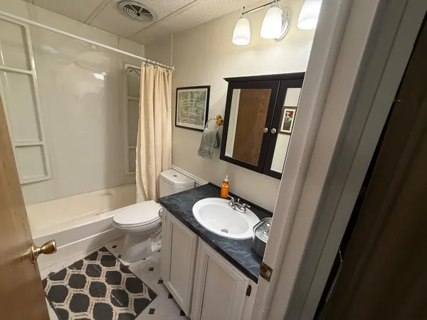 a room with gym equipment and flat screen tv