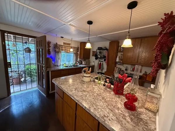 a living room with furniture and chandelier