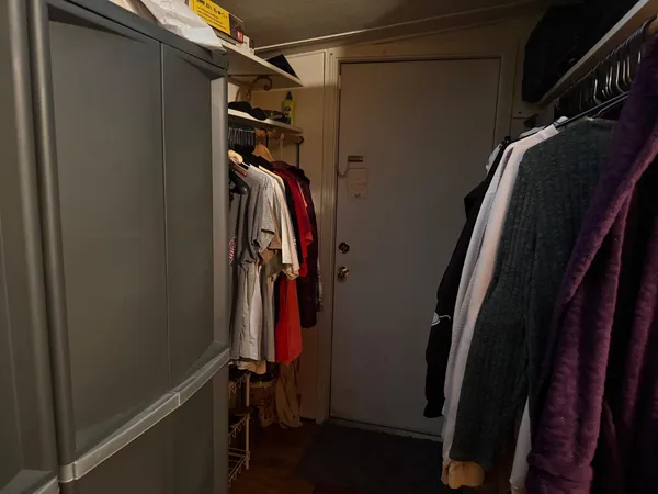 a room with wooden floor and furniture