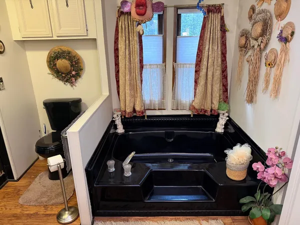 a living room with furniture and a red couch