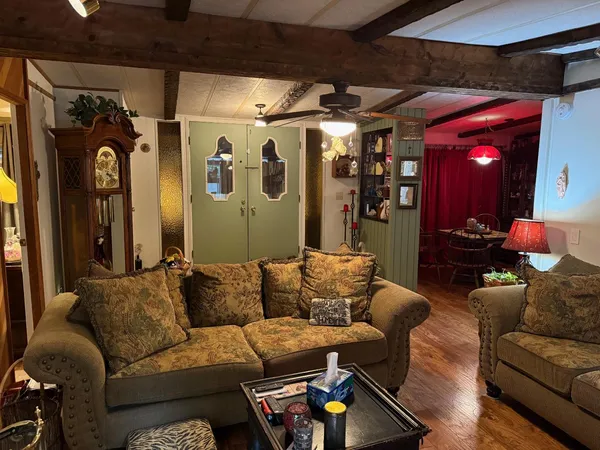 a view of a backyard with sitting area