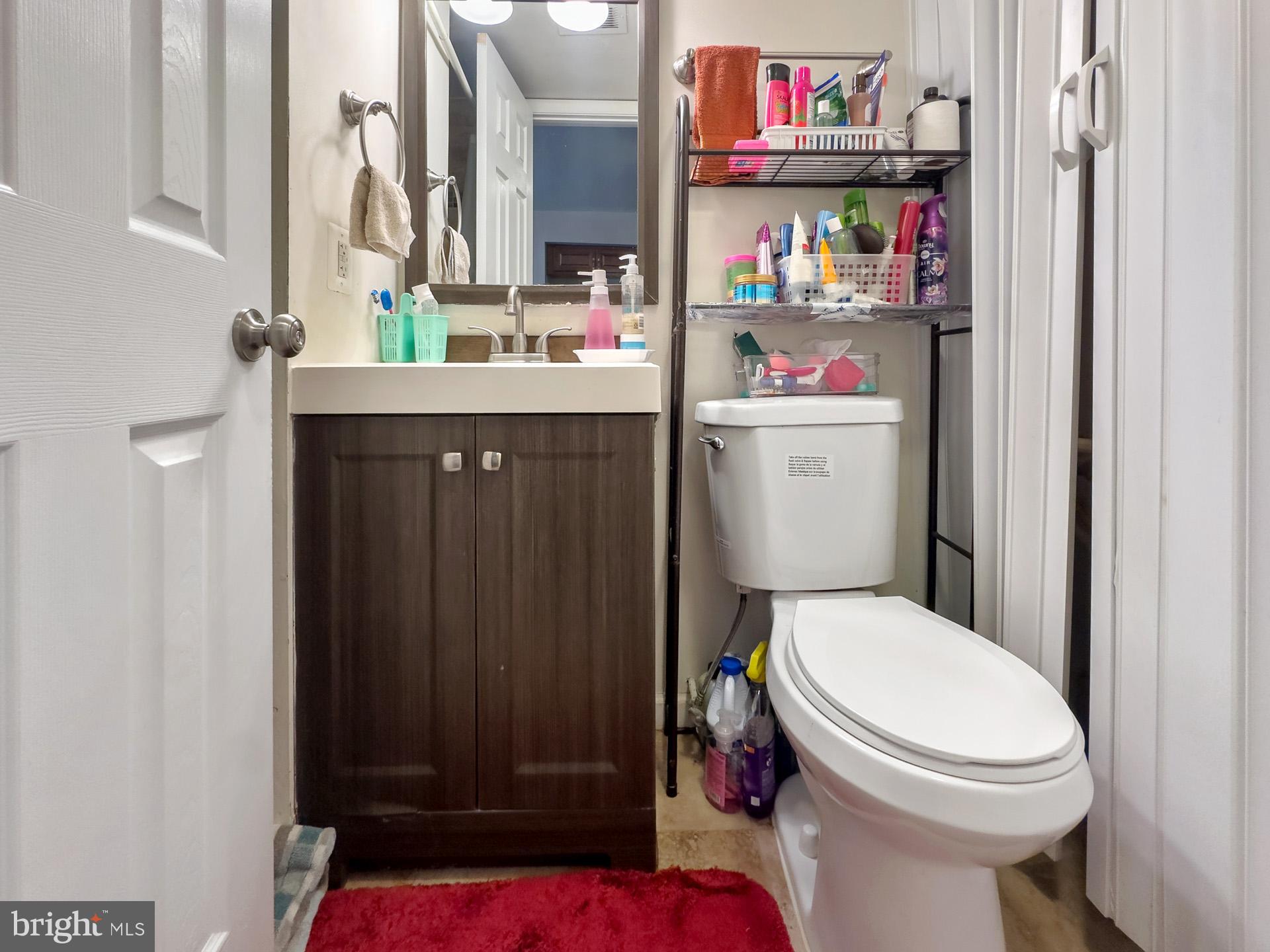 9315 Byrd Drive Manassas, VA 20110 - Photo 13 of 27 a bathroom with a toilet a sink and a shower