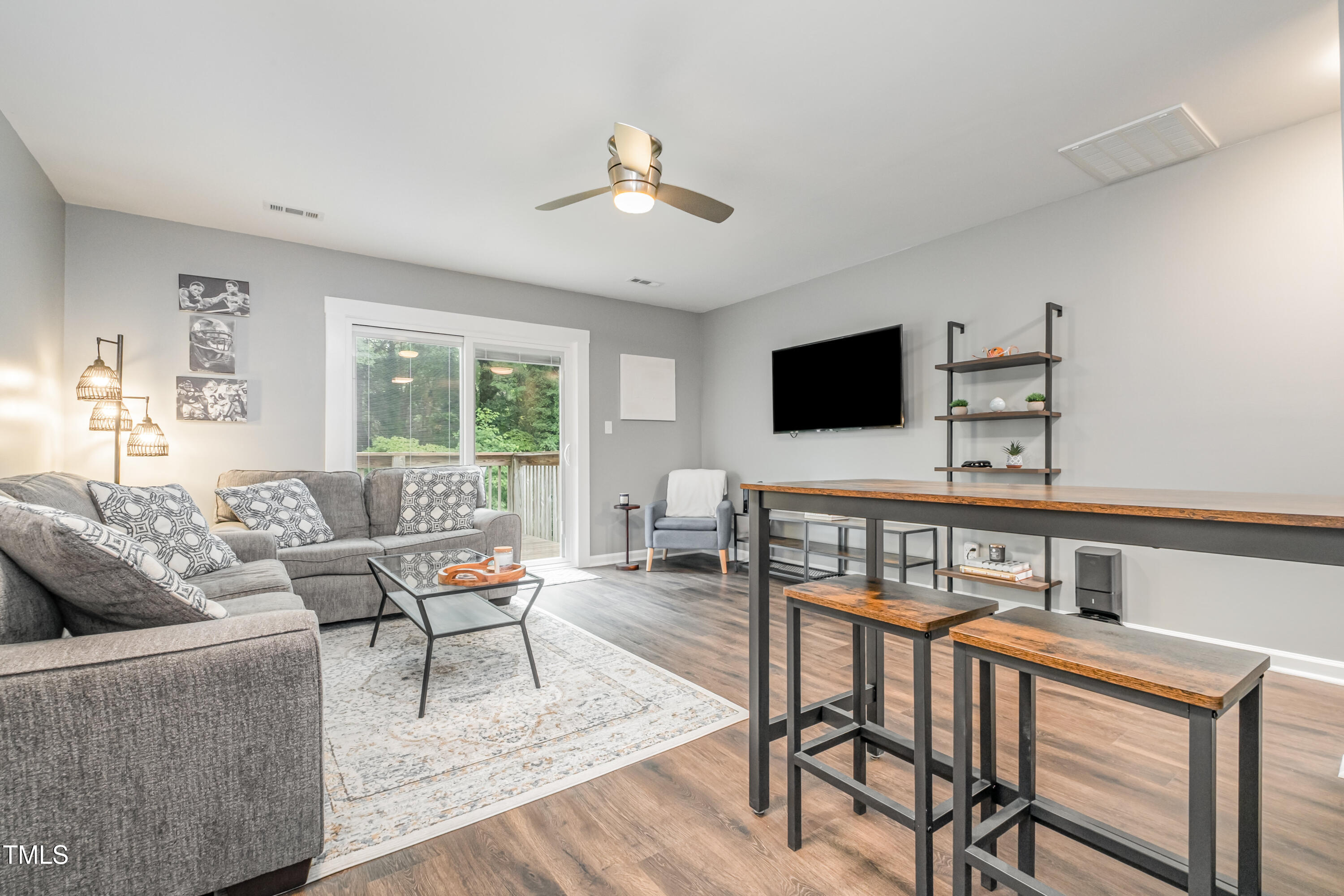 932 South 5th Street Mebane, NC 27302 - Photo 11 of 29 a living room with furniture and a flat screen tv