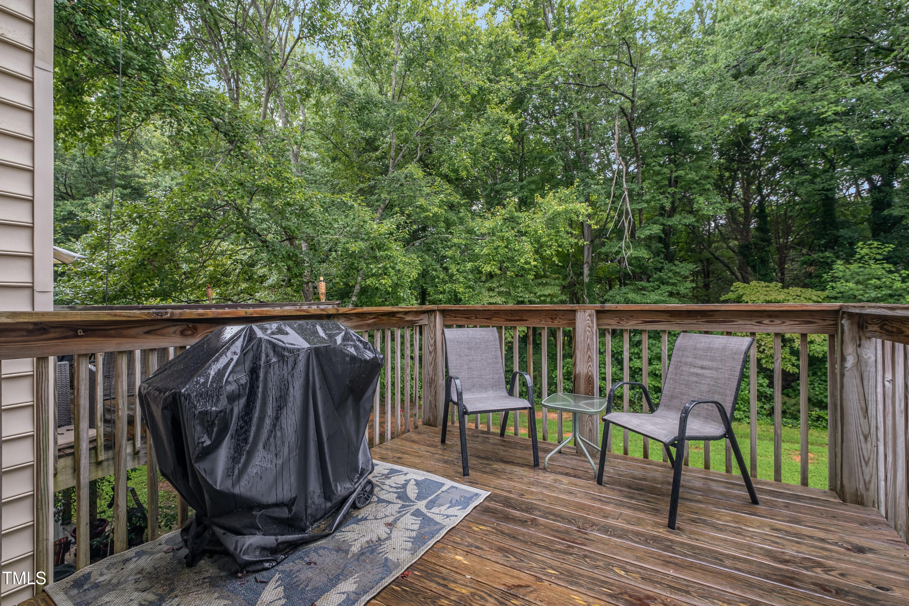 932 South 5th Street Mebane, NC 27302 - Photo 16 of 29 a view of roof deck with wooden floor and fence