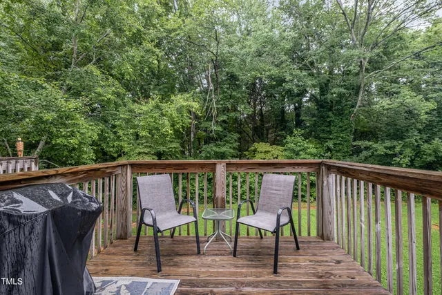 a view of deck with wooden floor and outdoor seating