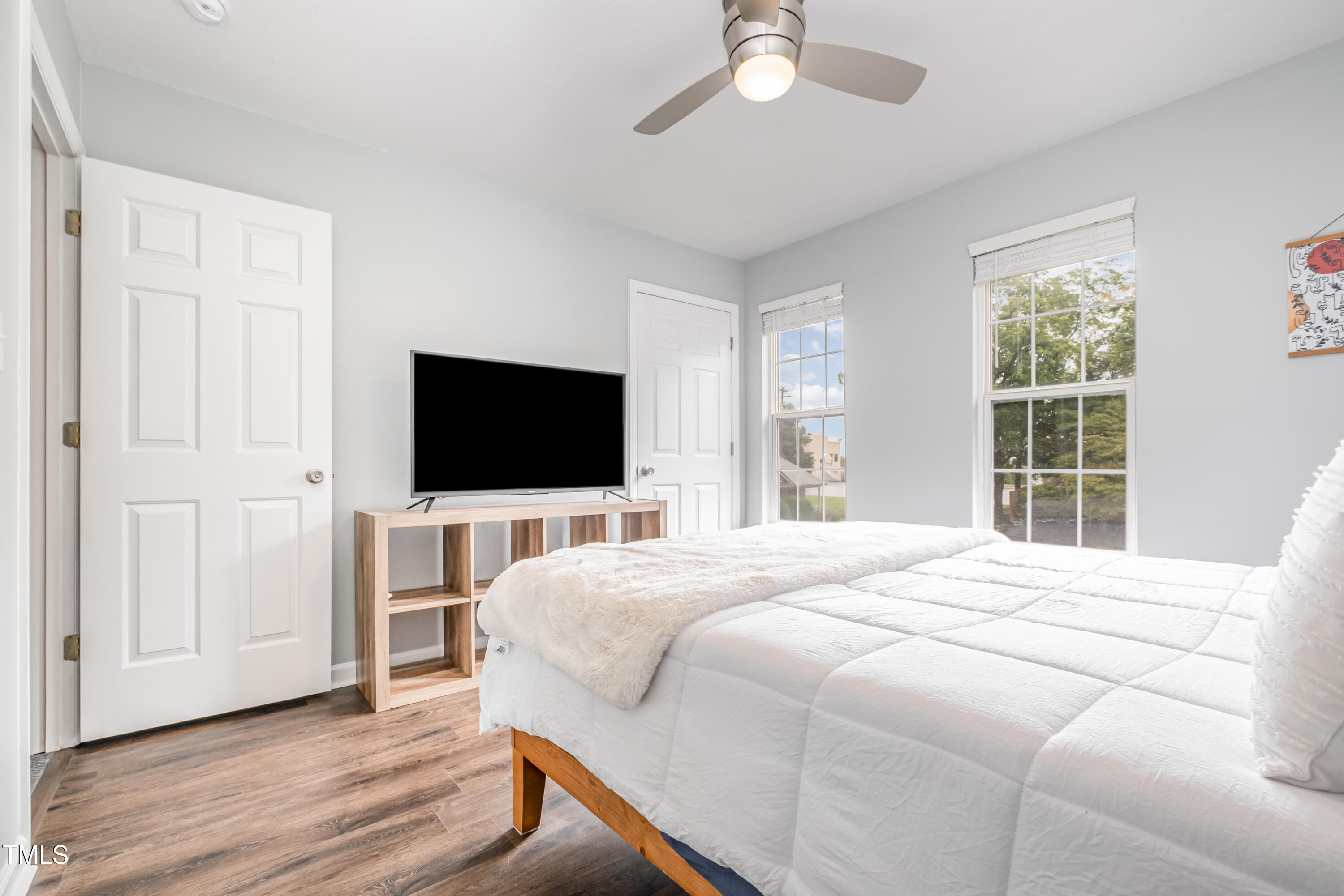 932 South 5th Street Mebane, NC 27302 - Photo 24 of 29 a bedroom with a bed and a flat screen tv