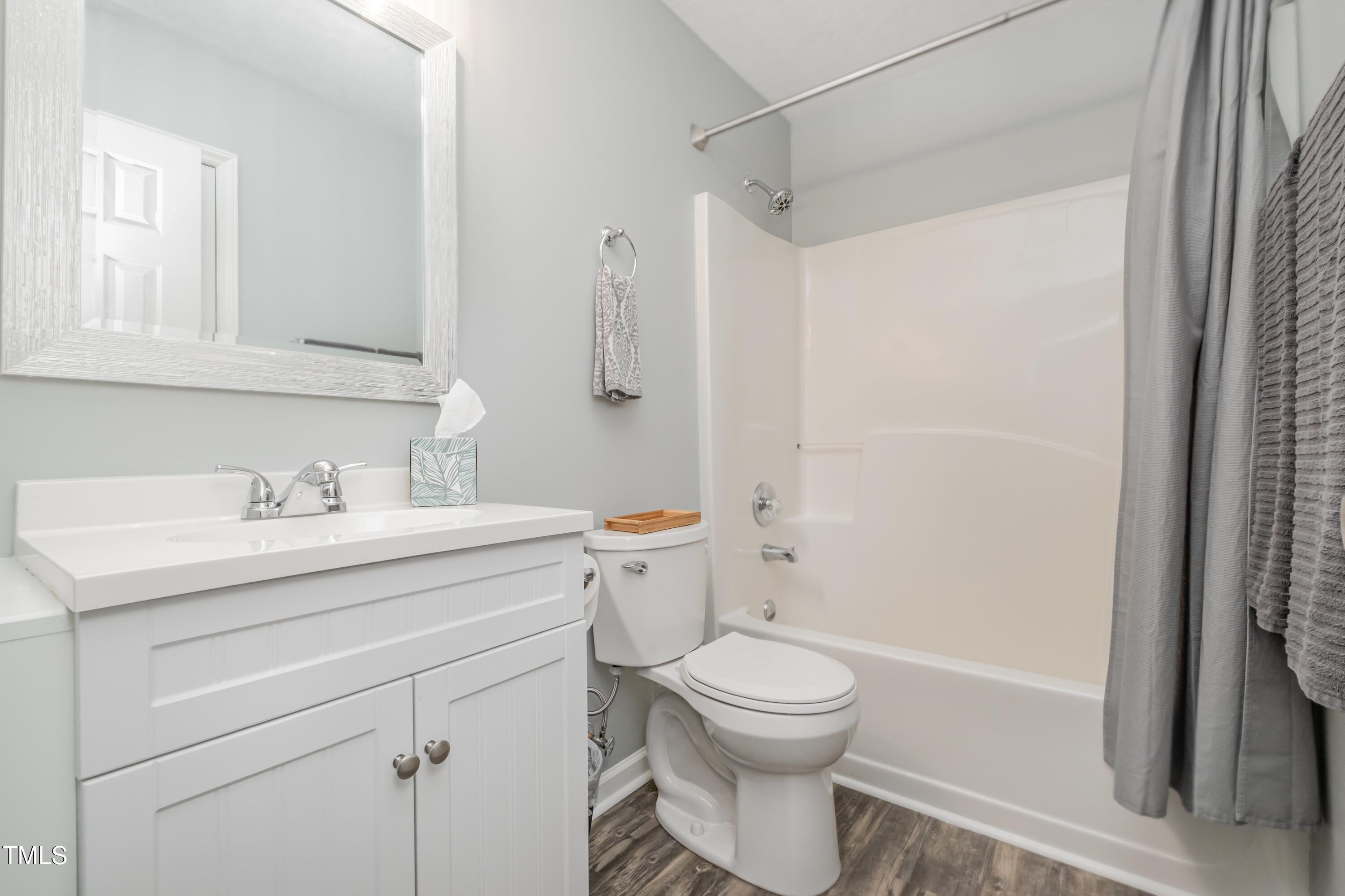 932 South 5th Street Mebane, NC 27302 - Photo 27 of 29 a bathroom with a sink toilet vanity and shower