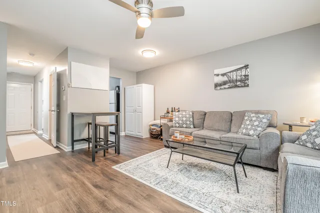 a living room with furniture and a table