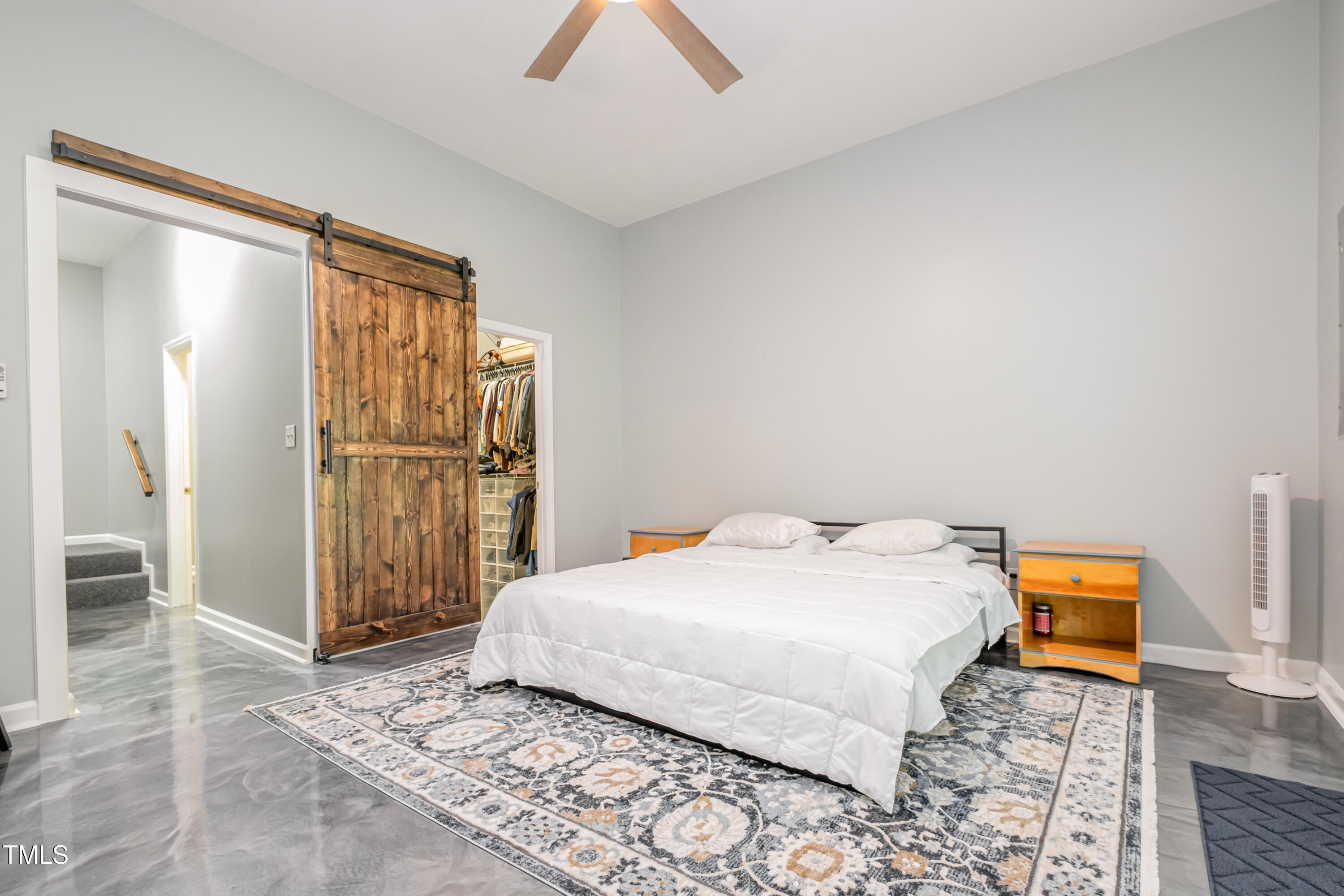 932 South 5th Street Mebane, NC 27302 - Photo 4 of 29 a bedroom with a bed and a table in it