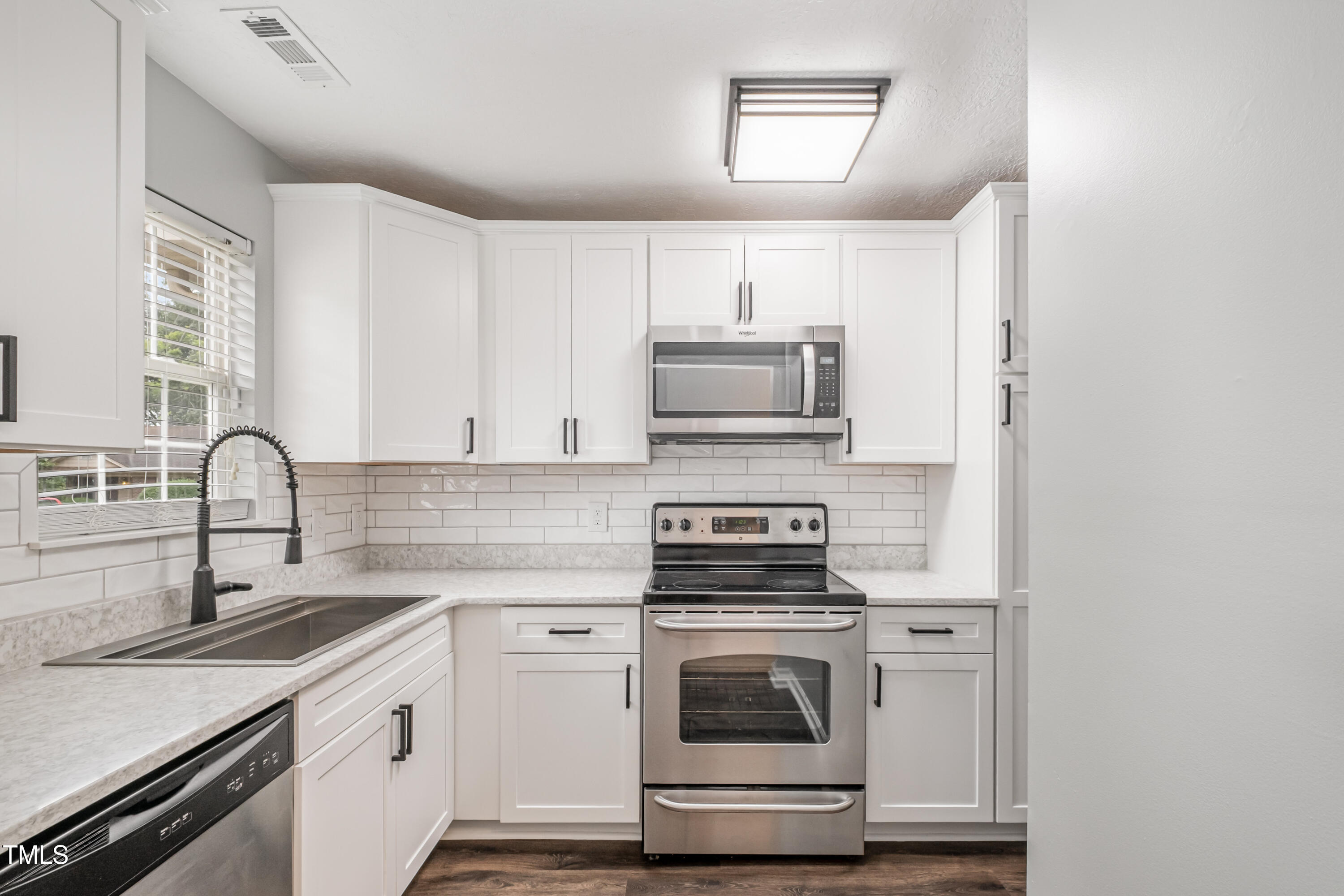 932 South 5th Street Mebane, NC 27302 - Photo 7 of 29 a kitchen with a stove and a sink