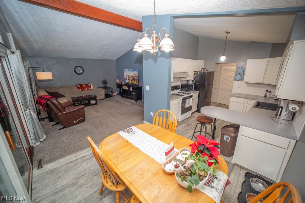 43655 Middle Ridge Road Lorain, OH 44053 - Photo 13 of 35 Family room, eat in kitchen & work area of kitchen.