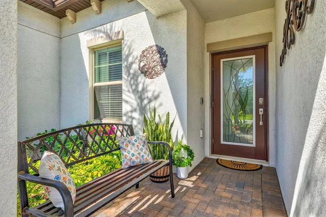 a view of a bench in back yard of a house