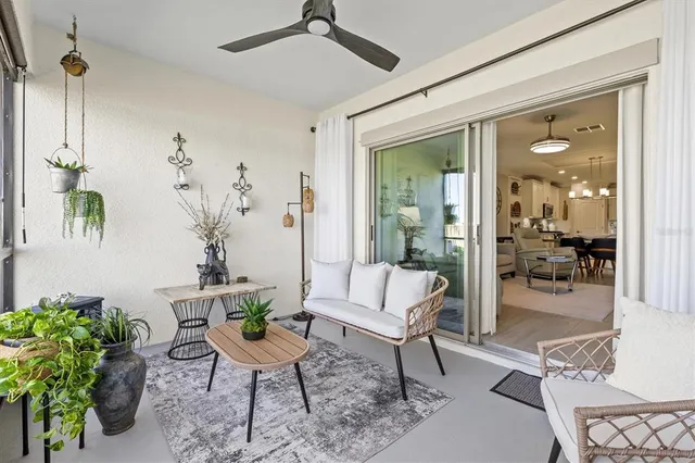 a view of a livingroom with furniture and a potted plant