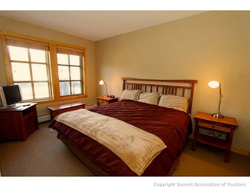 910 Copper Road, Unit 216 Copper Mountain, CO 80443 - Photo 6 of 18 a bedroom with a bed and a desk