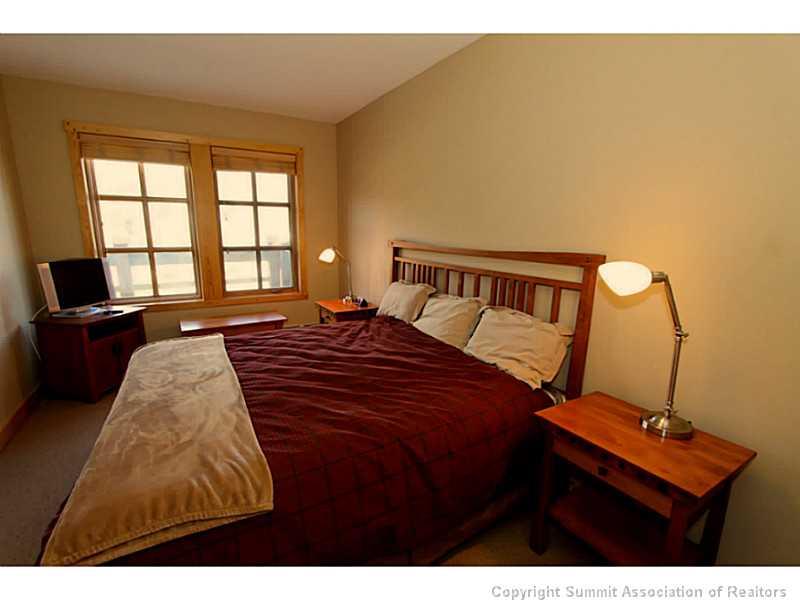 910 Copper Road, Unit 216 Copper Mountain, CO 80443 - Photo 7 of 18 a bedroom with a bed window and a desk