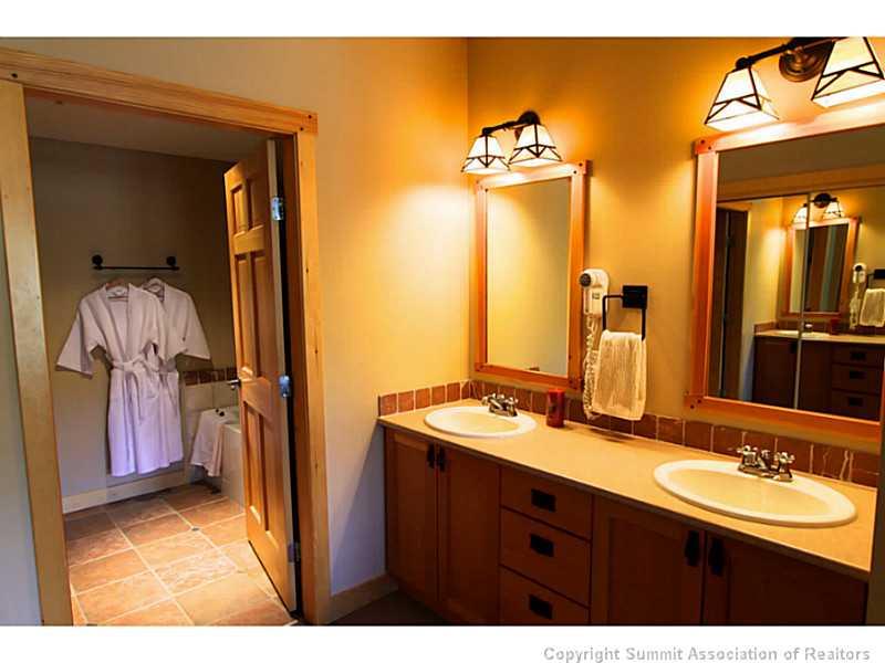 910 Copper Road, Unit 216 Copper Mountain, CO 80443 - Photo 8 of 18 a bathroom with a sink and a mirror