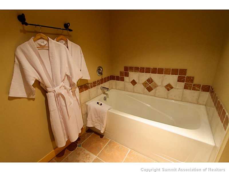 910 Copper Road, Unit 216 Copper Mountain, CO 80443 - Photo 9 of 18 a bathroom with a bathtub