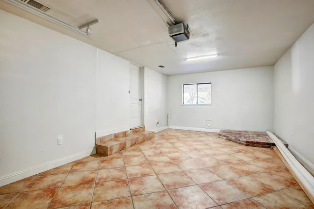 a room with a table and a mirror