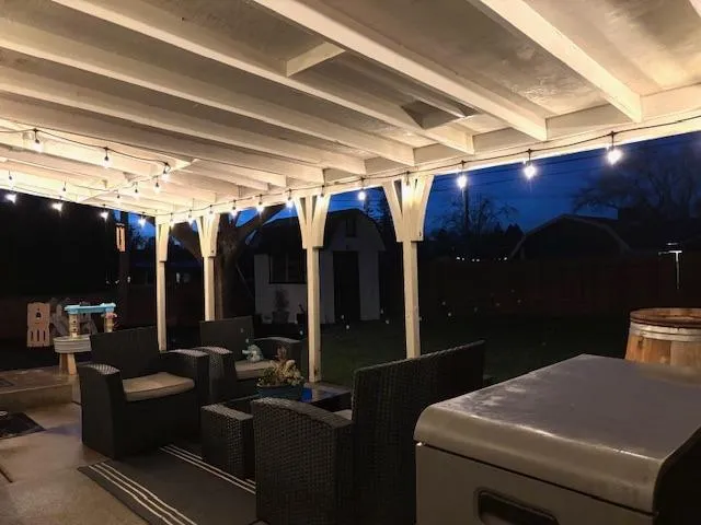 a view of backyard with barn and green space