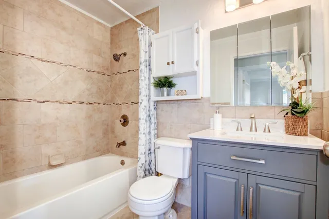 a kitchen with stainless steel appliances kitchen island granite countertop a sink and cabinets