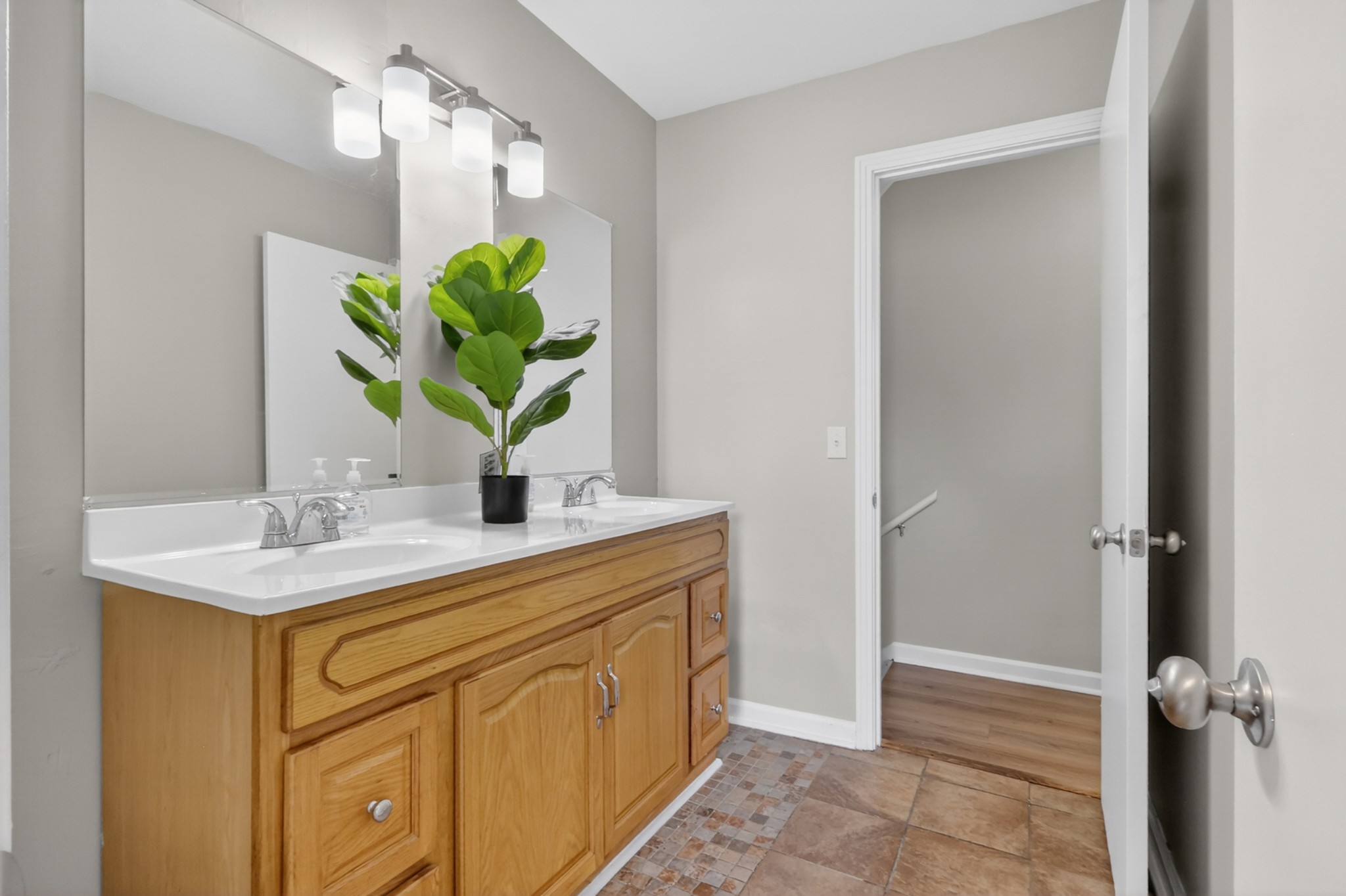 489 Canton Pass Madison, TN 37115 - Photo 14 of 25 a bathroom with a sink a vanity and a potted plant