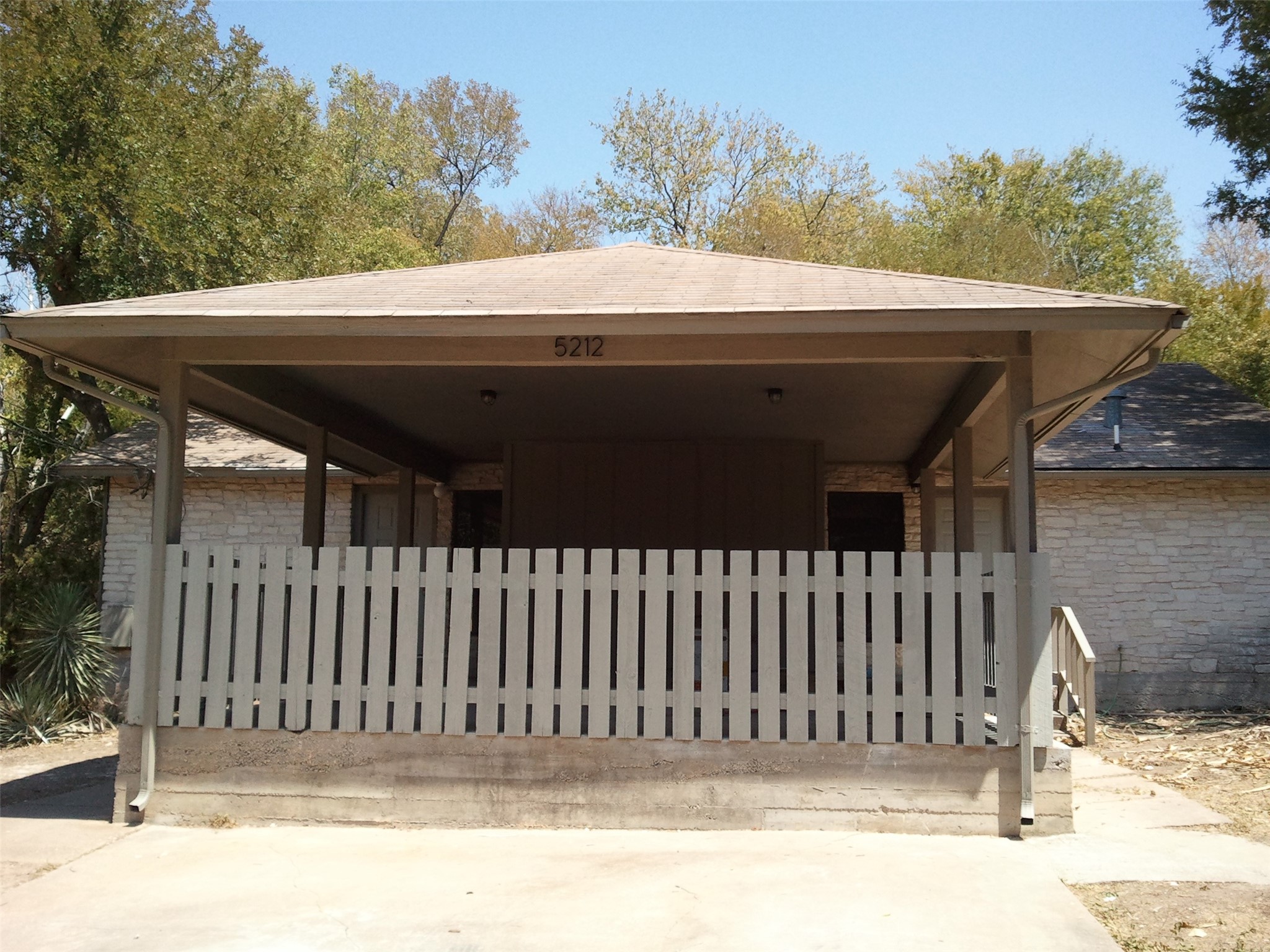 5212 Downs Drive Austin, TX 78721 - Photo 1 of 16 Front of duplex. Huge covered front porch