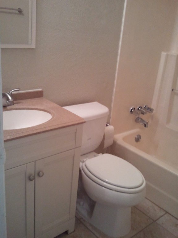 5212 Downs Drive Austin, TX 78721 - Photo 13 of 16 a white toilet sitting next to a bathroom sink