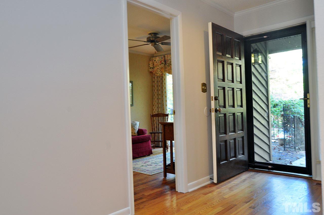 6 Pinnacle Road Durham, NC 27705 - Photo 12 of 24 a view of a hallway with wooden floor and windows