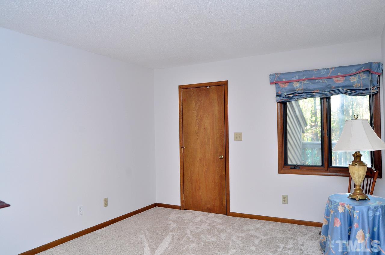 6 Pinnacle Road Durham, NC 27705 - Photo 14 of 24 a view of an empty room with a window
