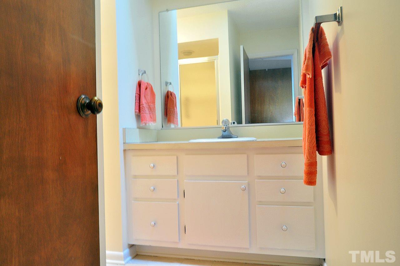 6 Pinnacle Road Durham, NC 27705 - Photo 15 of 24 view of bathroom with a sink and a mirror
